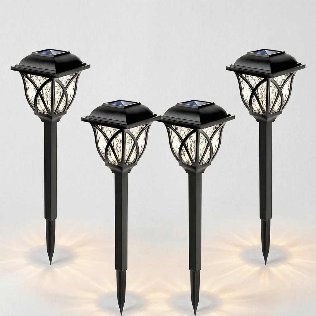 Outdoor solar path lights illuminating a garden walkway at night