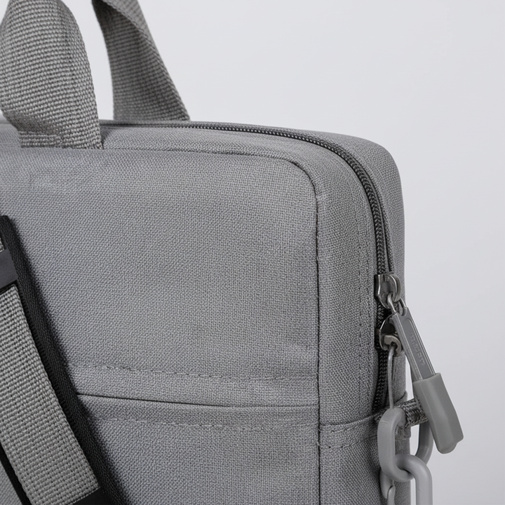 Business travel computer case being placed inside a larger backpack