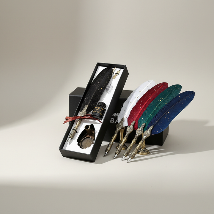 Red feather dip pen and ink set next to alternative colored pens and stands