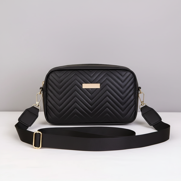 Interior lining and zipper pocket detail of the compact quilted mini bag