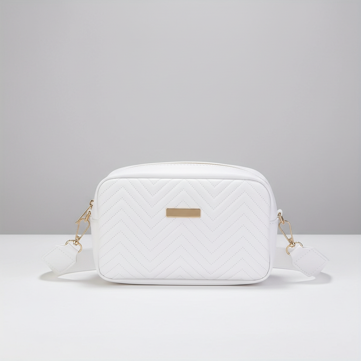 Assorted collection of quilted mini crossbody bags in classic black and white