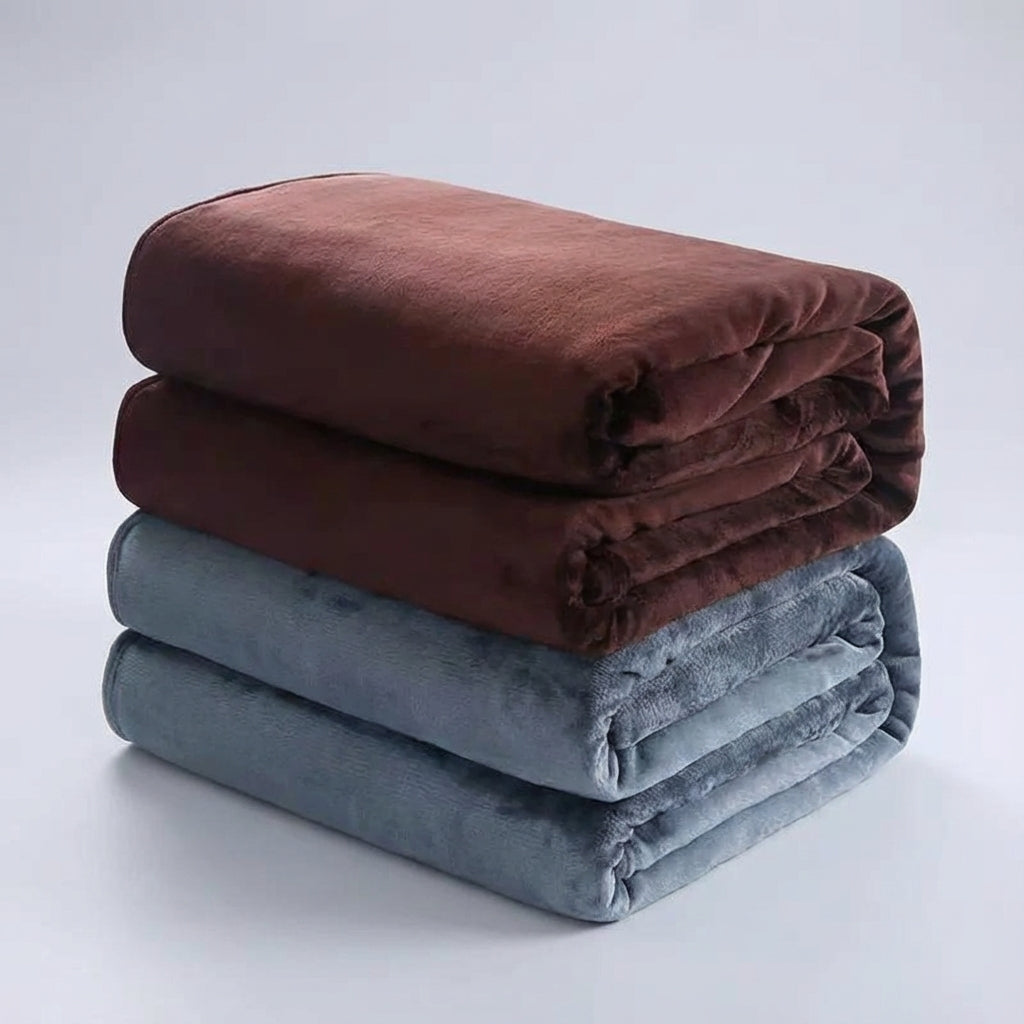 Warm and cozy Snugluma bed throw styled in a minimalist bedroom