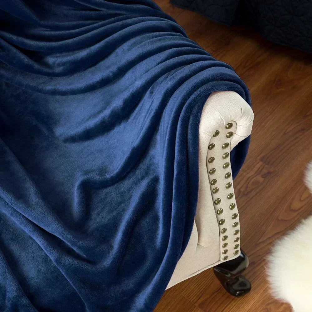Side view of Snugluma plush throw blanket revealing velvety softness