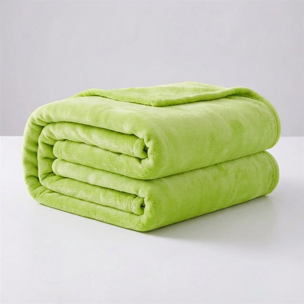 A neatly folded lime green plush throw blanket displayed against a clean light background.