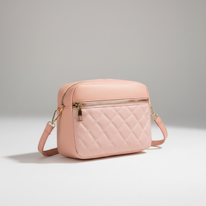 Assortment of black, white, and pink quilted crossbody bags