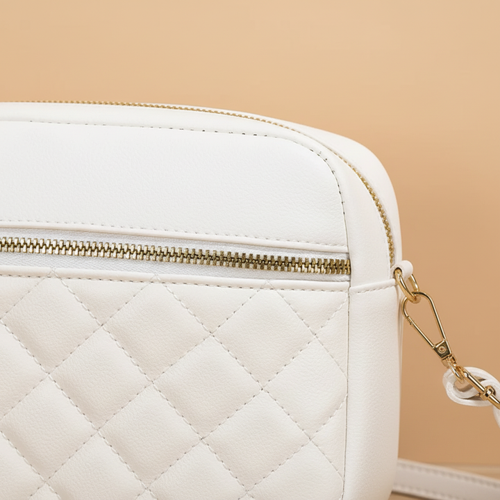 Women's white quilted handbag with shoulder strap