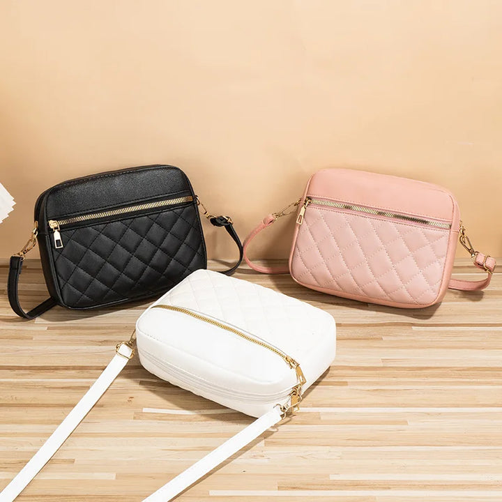 Close-up view of diamond pattern on quilted shoulder bag
