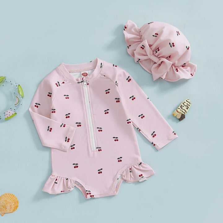 Pink baby sun protection swim set including rash guard and hat