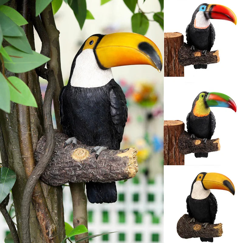 Hanging toucan bird statue displayed on an outdoor tree trunk