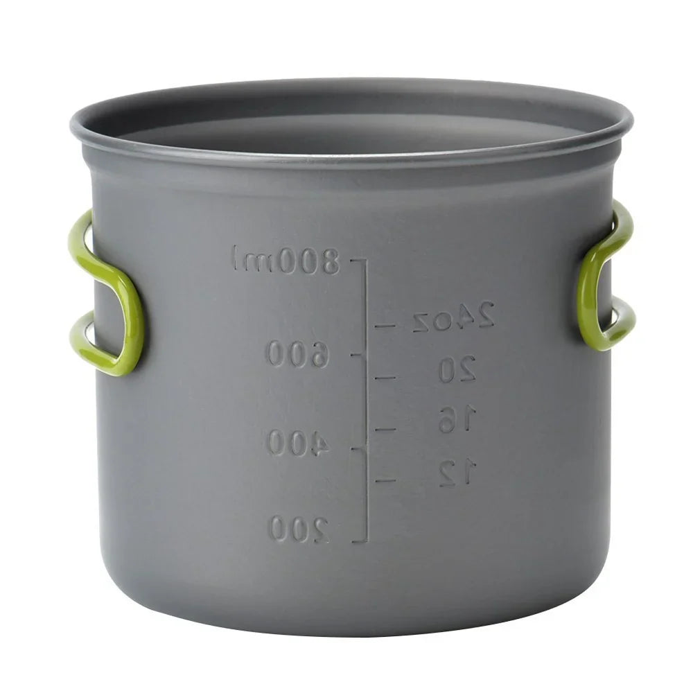 Essential backpacking gear showing portable camp cooking pots with lids