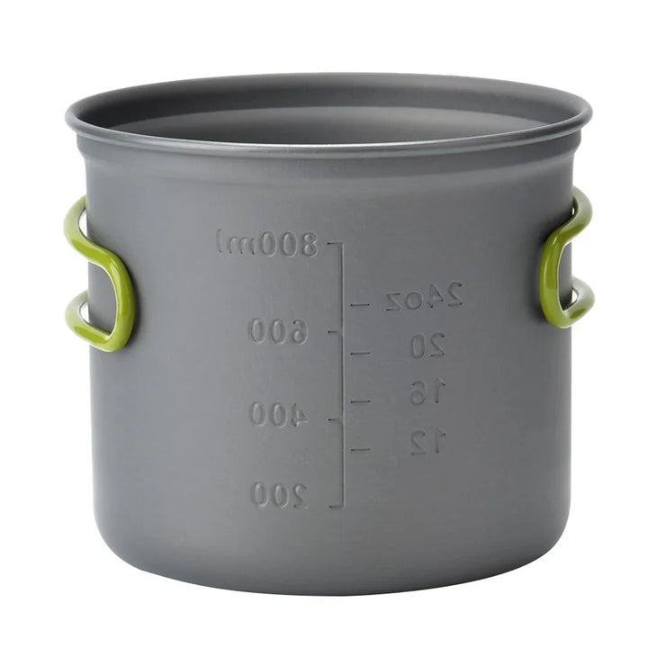 Essential backpacking gear showing portable camp cooking pots with lids