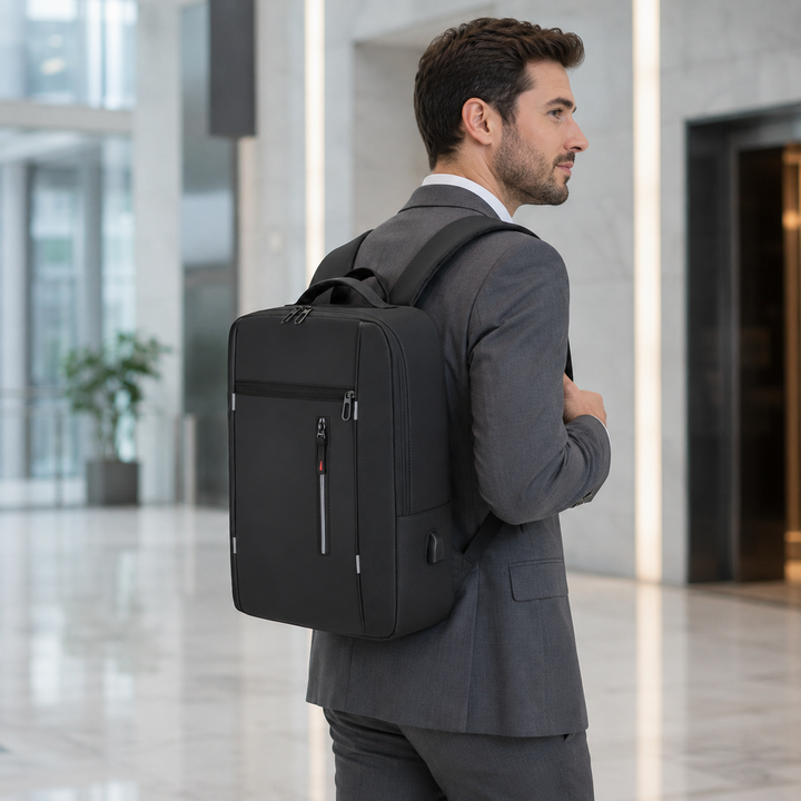 Business laptop backpack front pocket open showcasing accessory slots