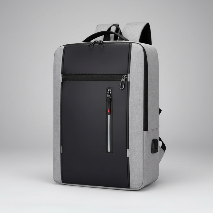 Gray and black business backpack with USB port against a neutral background