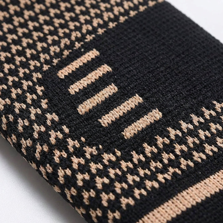 Detailed view of the breathable knit pattern and texture on the wrist sleeve