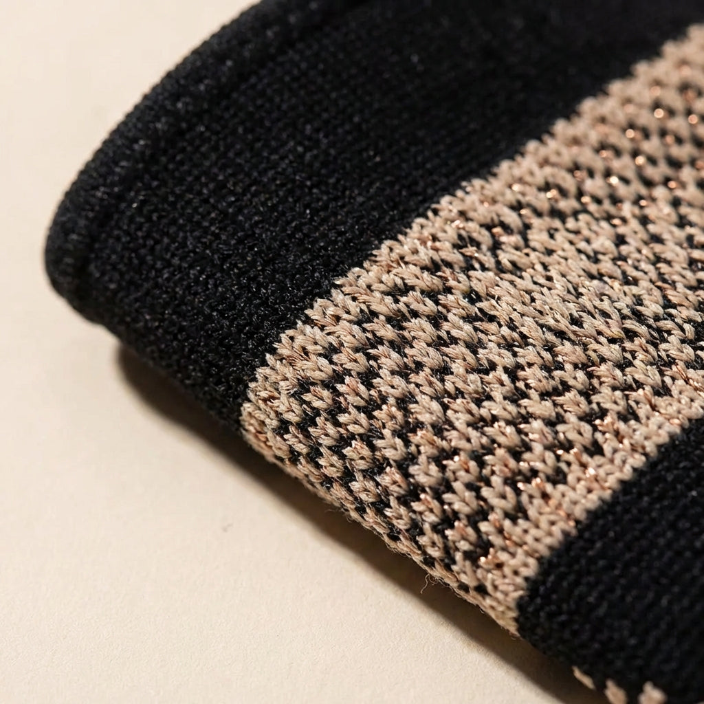 Macro detail of the breathable woven texture and pattern of the wrist sleeve