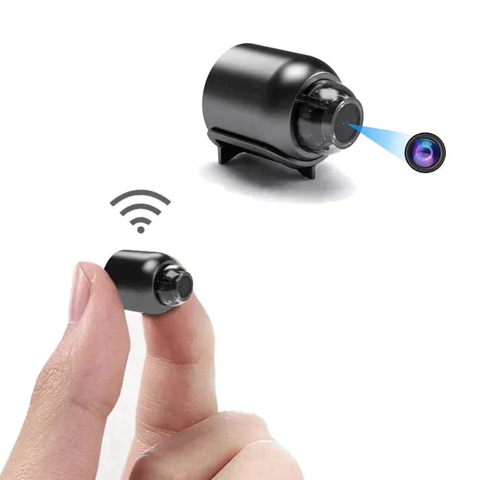 Compact wireless outdoor WiFi security camera held between fingers