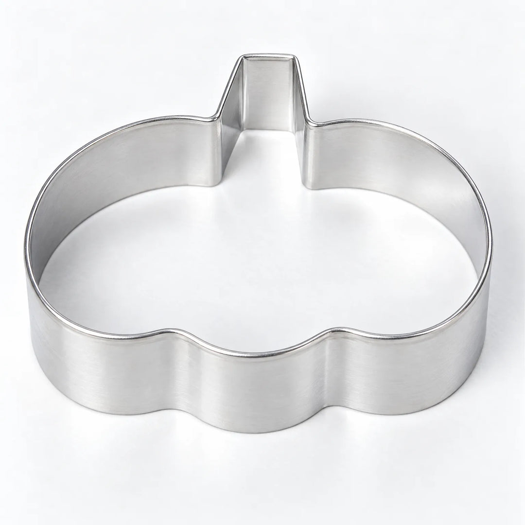 Close-up of metal cookie molds from a Halloween baking set, perfect for spooky holiday treats.