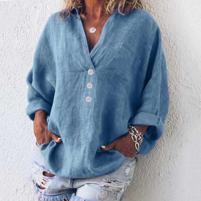 Woman wearing a blue oversized v-neck long sleeve casual blouse