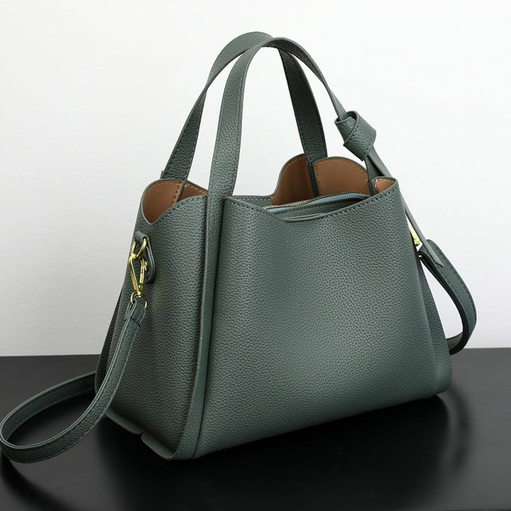 Women's Luxora elegant brown handbag worn as a stylish shoulder bag