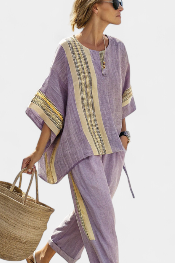 Close-up of a woman in a purple matching set with artisan stripe details