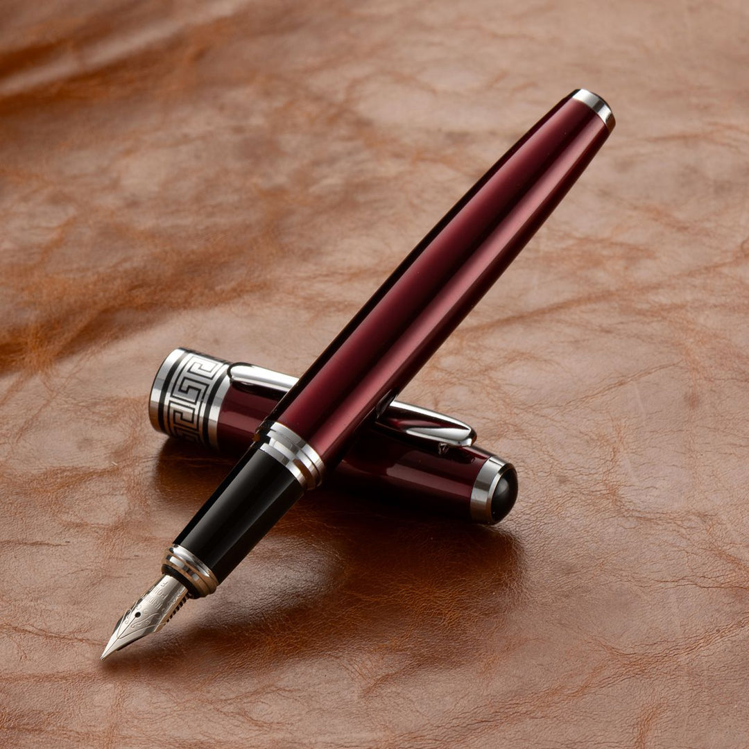 Stationery fountain pen showcasing detailed cap engraving