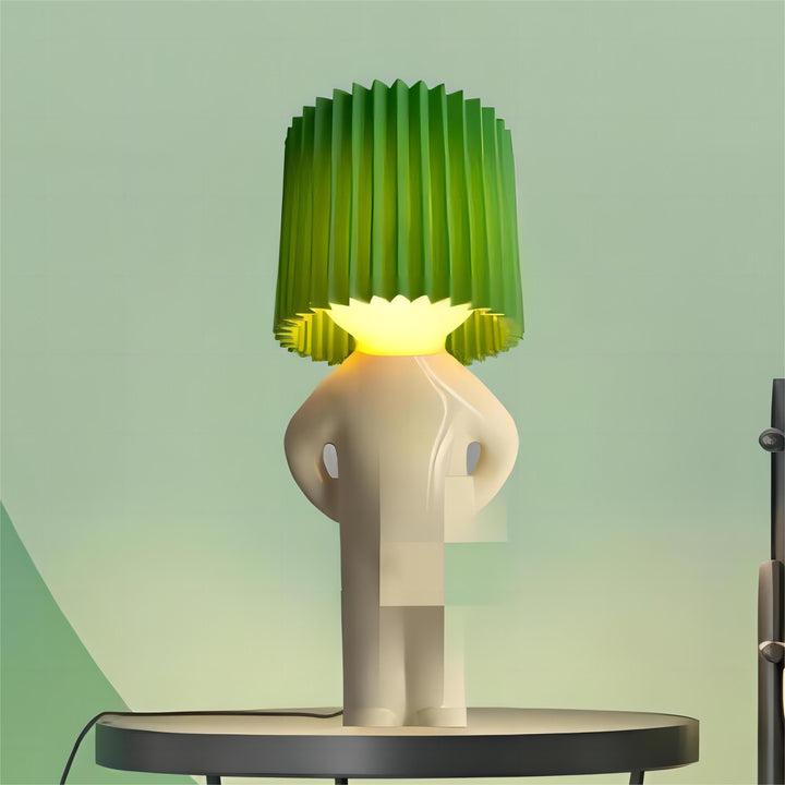 Green cordless decorative LED table lamp on a table