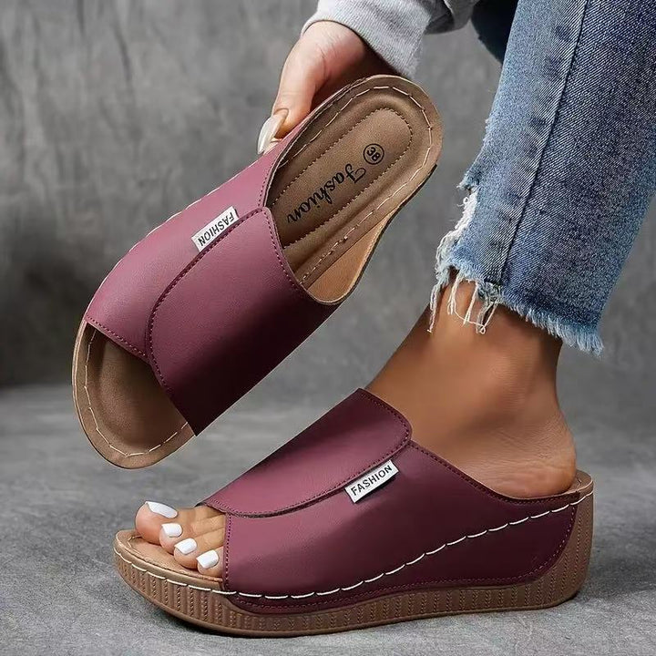 Side view of women's orthopedic wedge sandals showing comfortable arch support sole.
