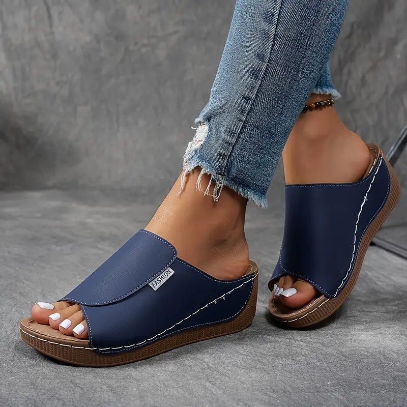 Angle view of stylish arch support wedge sandals designed for everyday wear.