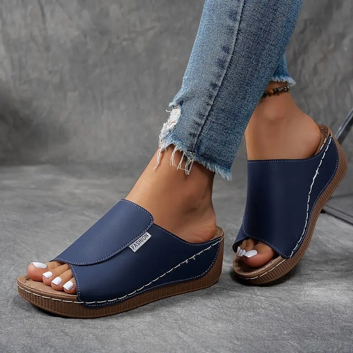 Angle view of stylish arch support wedge sandals designed for everyday wear.