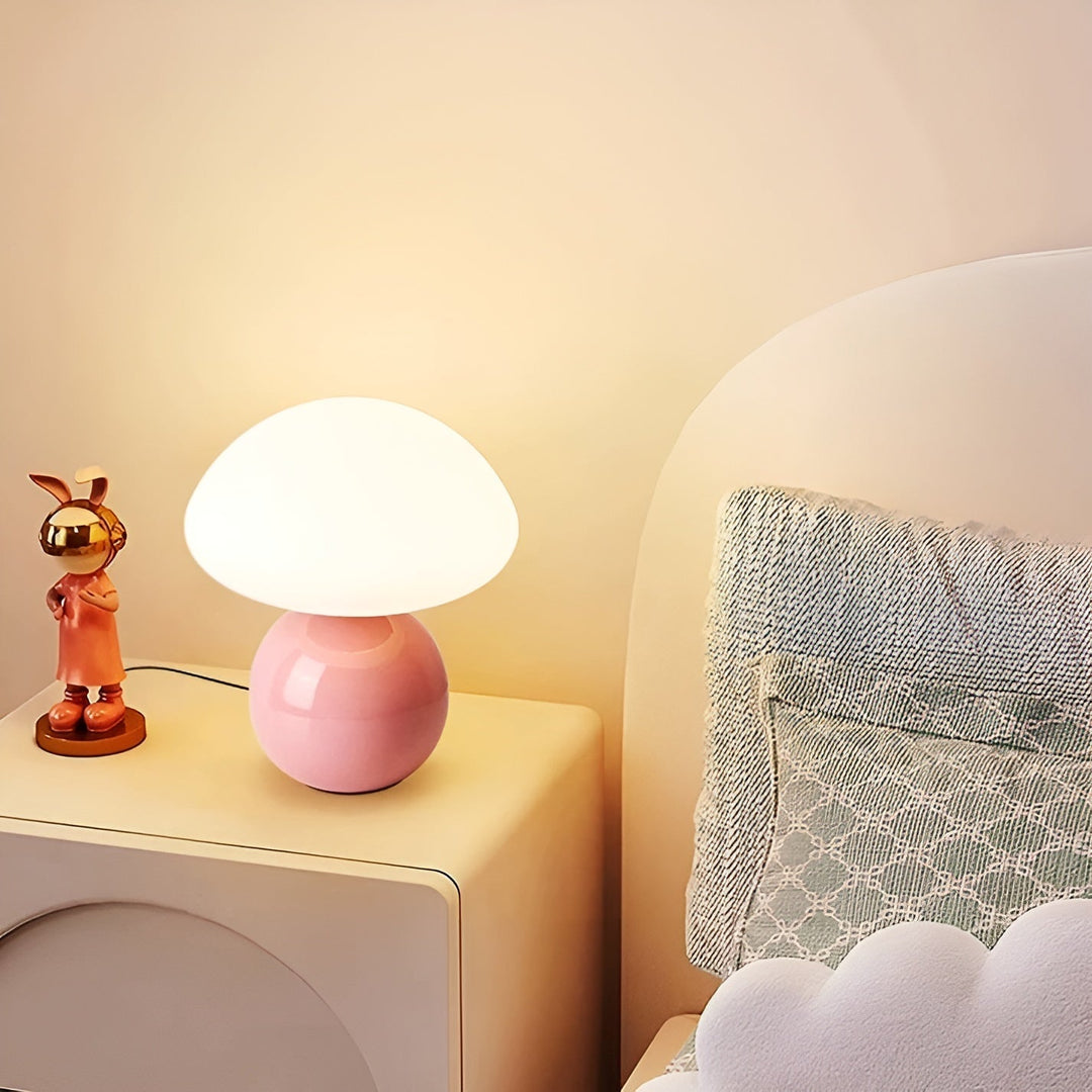 Pink elegant mushroom LED table lamp on a bedside nightstand
