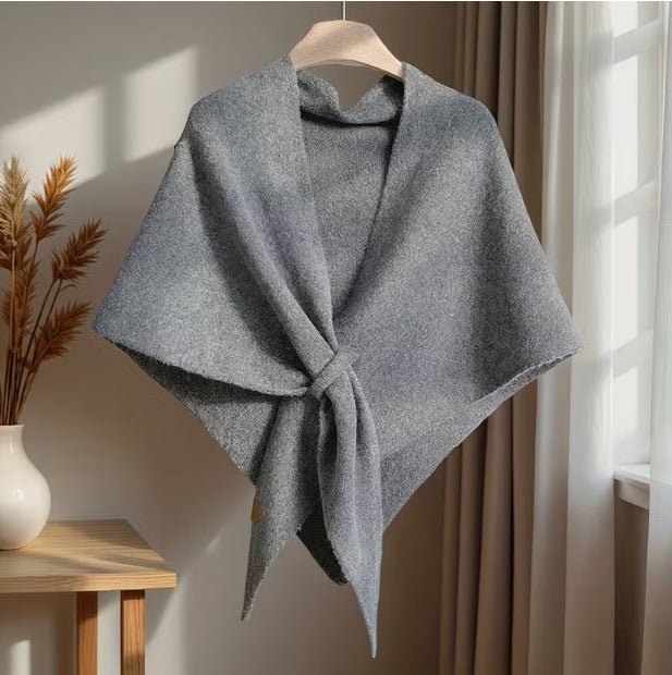Close up view of soft knit texture on womens winter poncho wrap scarf