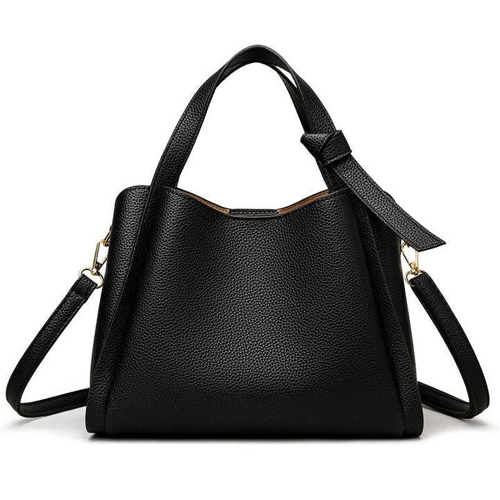 Spacious interior compartment and pockets of the versatile daily shoulder bag