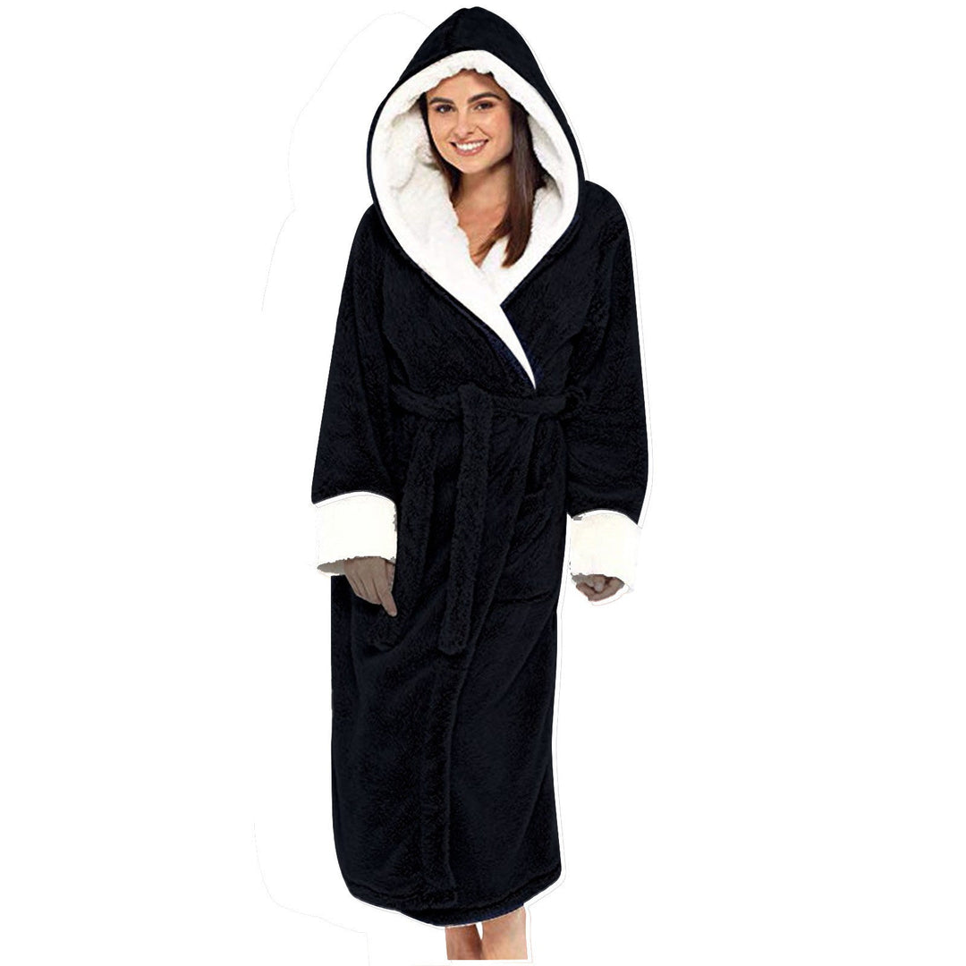 Women wearing a black plush hooded fleece bathrobe with white contrast trim