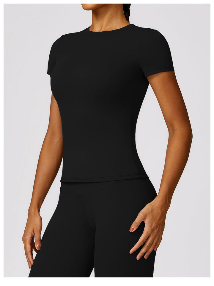 Short sleeve athletic top paired with matching fitness shorts
