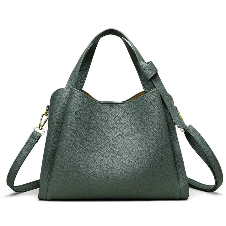 Close-up of premium hardware and stitching on the women's luxury handbag