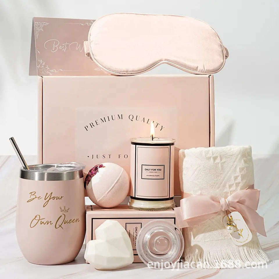 Complete luxury bath gift set in pink presentation box with tumbler, candle, eye mask, and towel