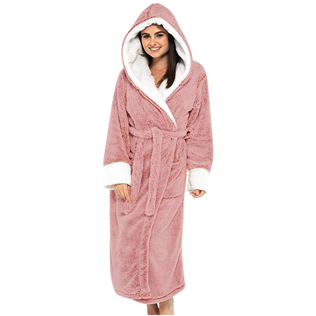 Women wearing a pink plush hooded fleece bathrobe with white contrast trim