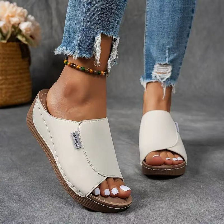 Top-down view of women's casual wedge sandals with adjustable straps for comfort.