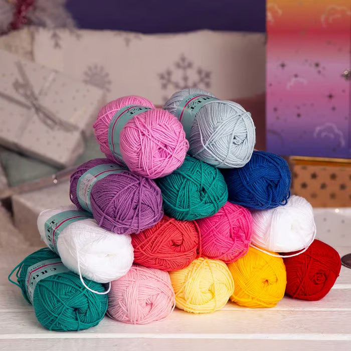 Close-up view of various colorful yarn skeins included in the crochet advent calendar.