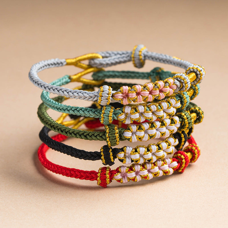 Stack of colorful blossom knot bracelets in various shades