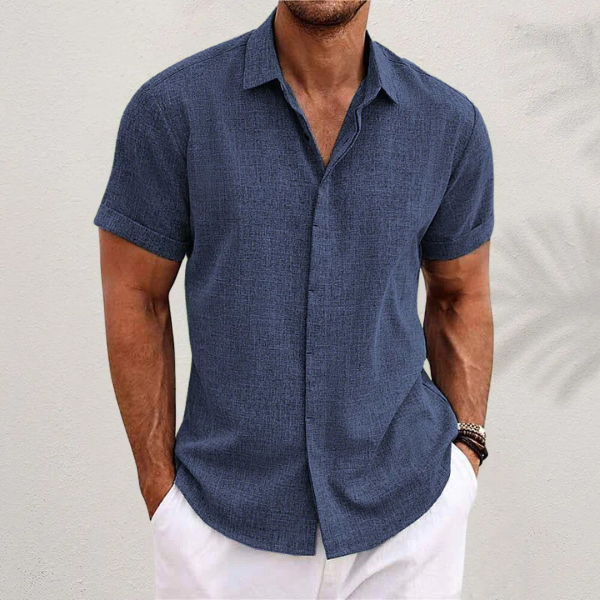 Close-up fabric detail of mens casual short-sleeve button down shirt