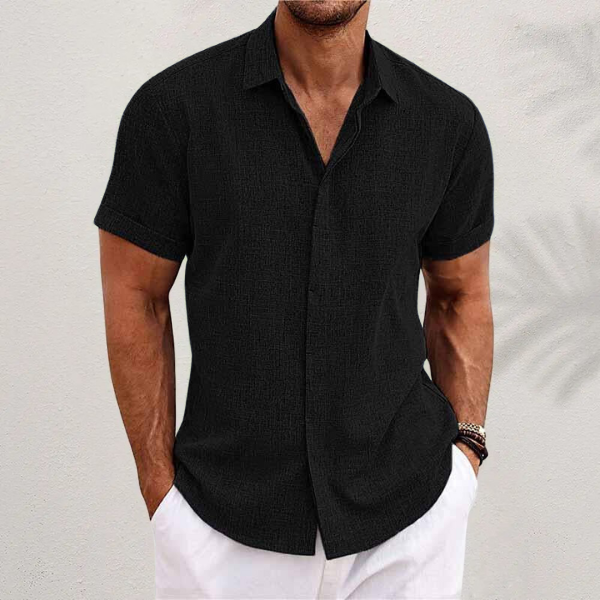 Folded mens short-sleeve button-down shirt showcasing summer style