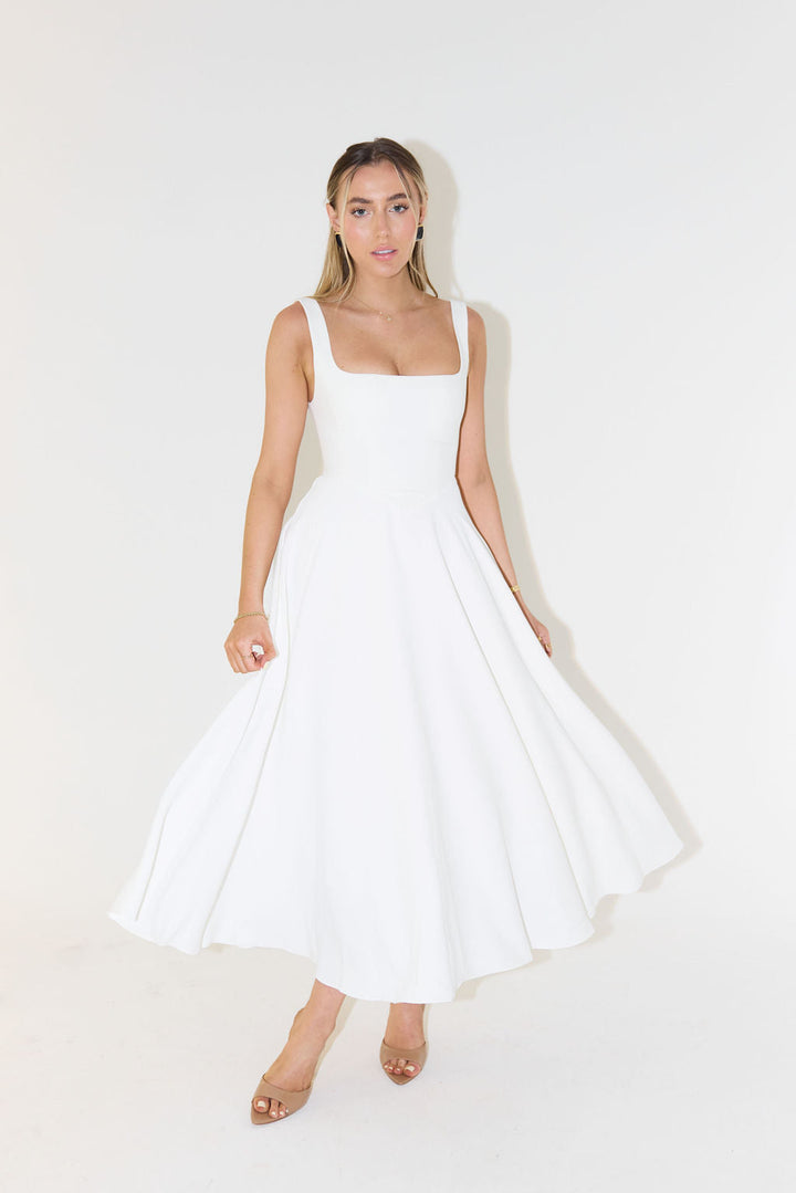 Model wearing a white square neck sleeveless midi dress