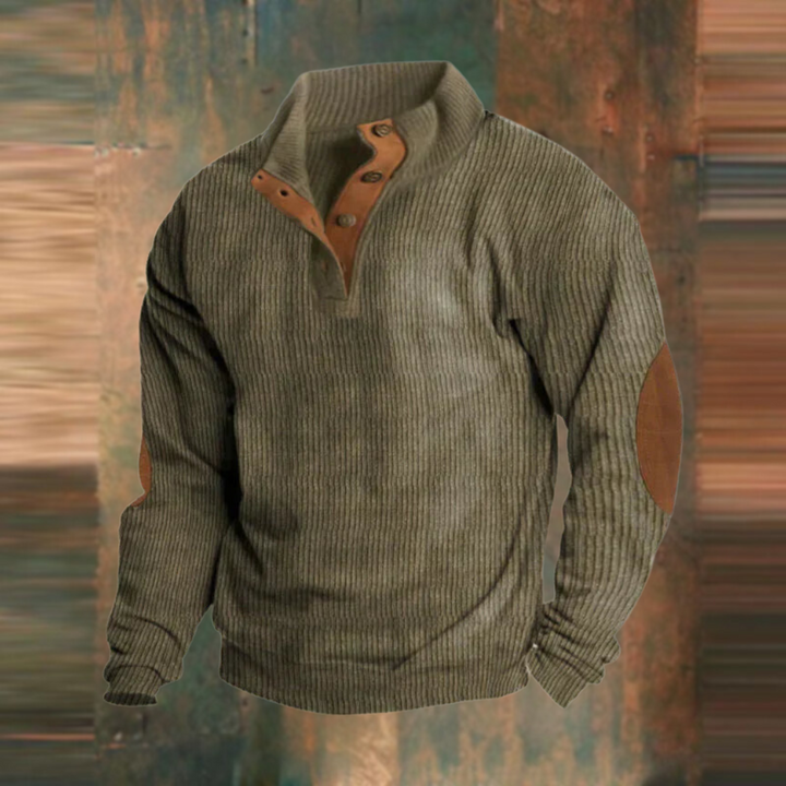 Men's green ribbed button-collar knit jumper displayed on a rustic background
