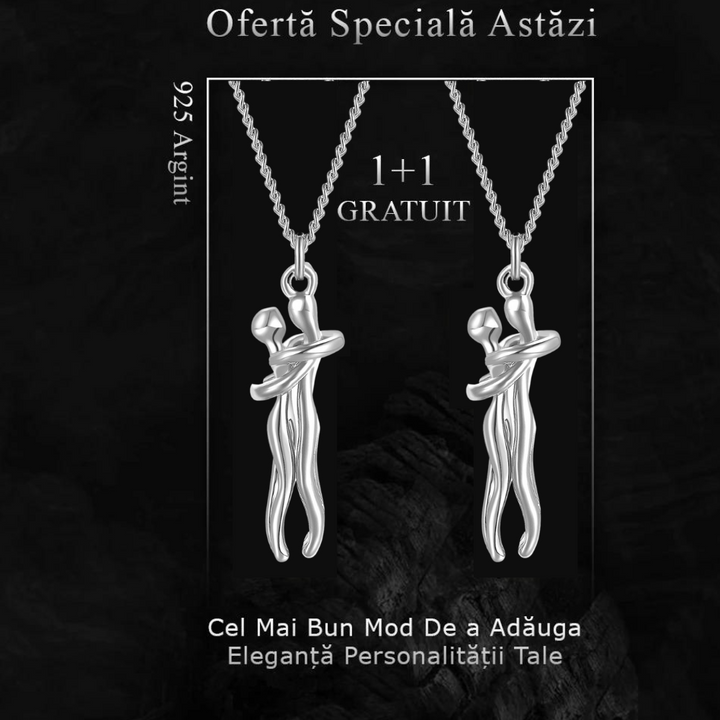 Detailed shot of the interlocking silver figures on the pendant necklace