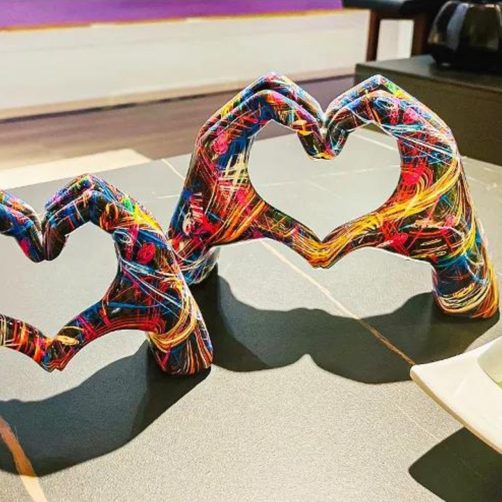 Angle view of the colourful hand art sculptures showing vibrant graffiti details