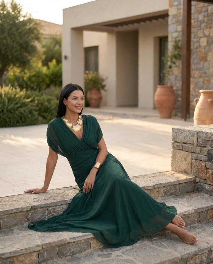 Women's gala maxi dress showcasing beautiful off shoulder draping