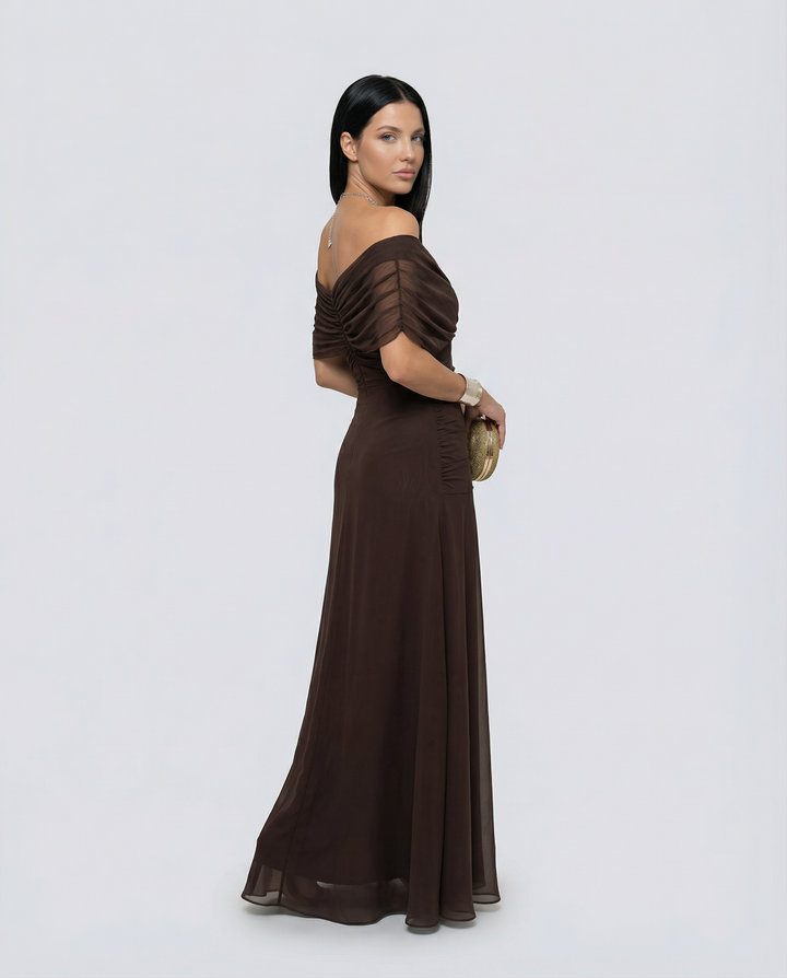 Stunning formal gown featuring off shoulder design and soft drape