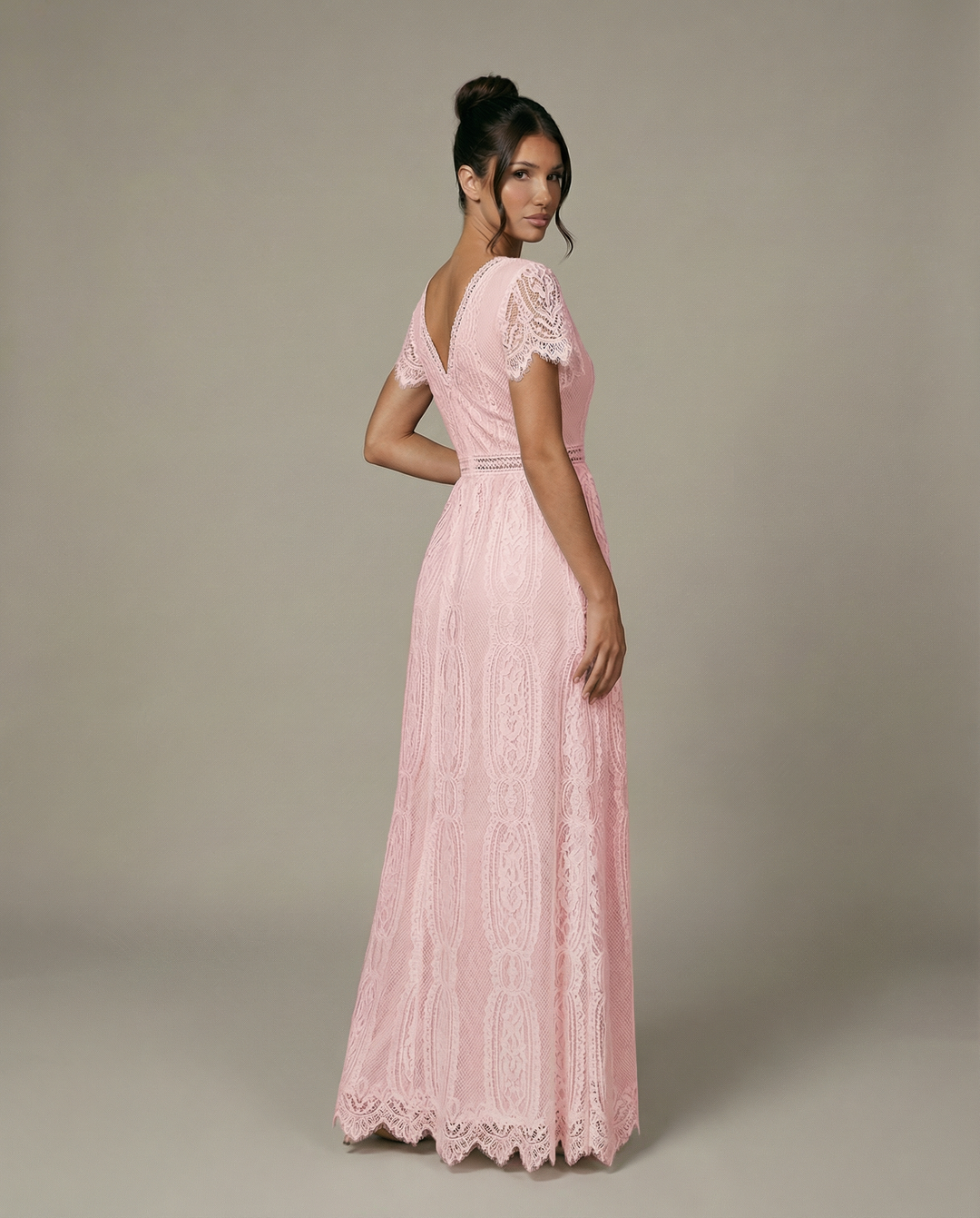Side profile of flowing white lace maxi dress for special occasions