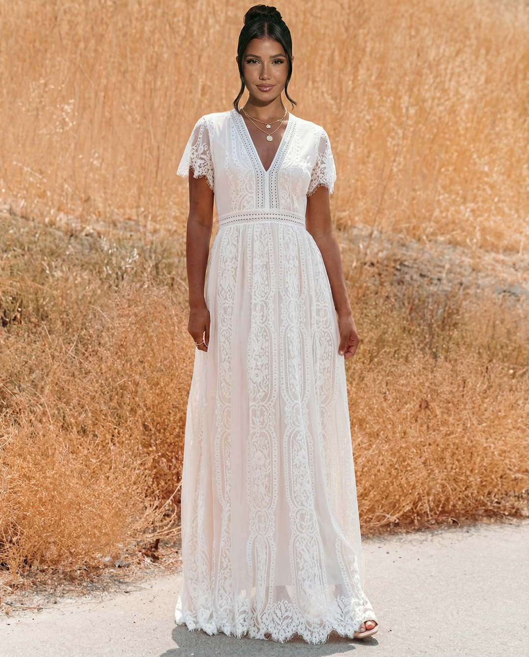 Pink lace maxi dress featuring floral pattern and sleeveless design
